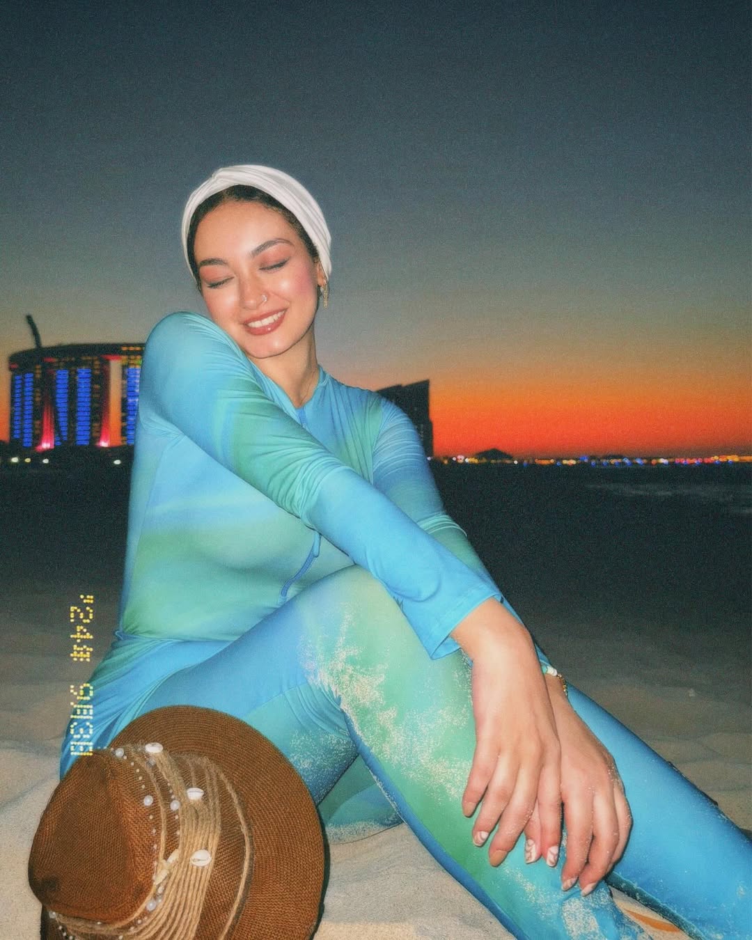 Image of ุขูุงุก ๐ง๐ป from Instagram long-sleeve swimsuit, turban, beach, barefoot, sunset, hat with shells