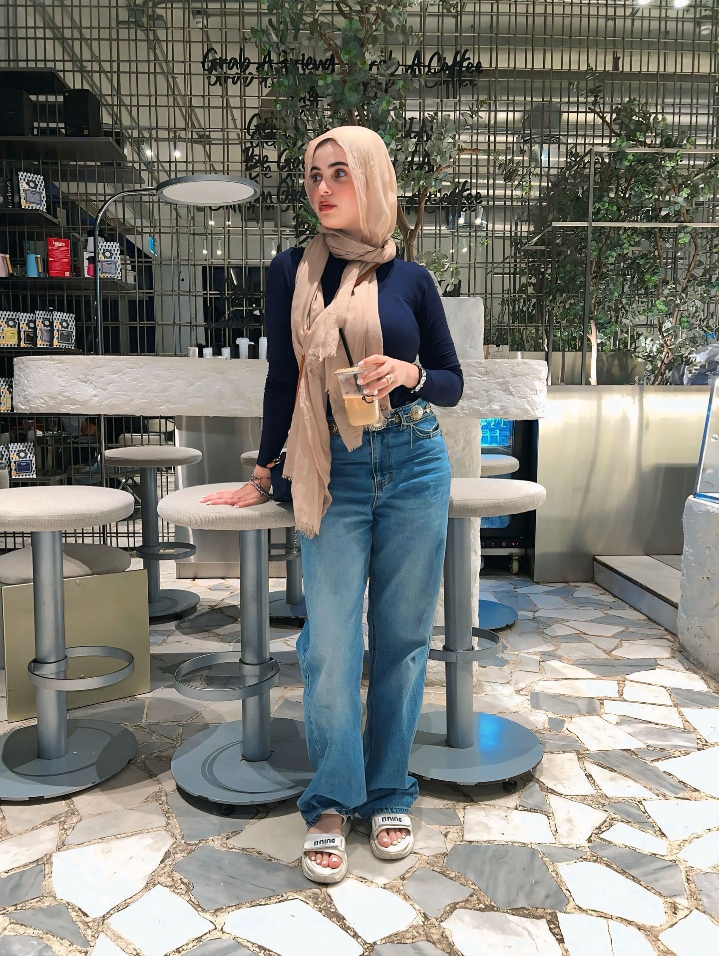 Image of Rehab Amgad from Instagram hijab, scarf, long sleeves, jeans, sandals, café, fashion