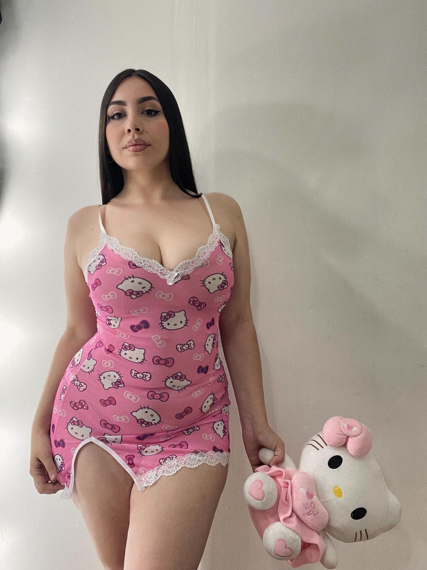 Image of Génesis Ortiz from Instagram dress, pink, Hello Kitty, lace, stuffed toy, indoors, barefoot