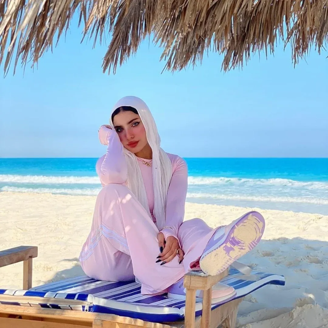Image of Yasmin Samir from Instagram beachwear, modest fashion, casual, pastel colors, sneakers