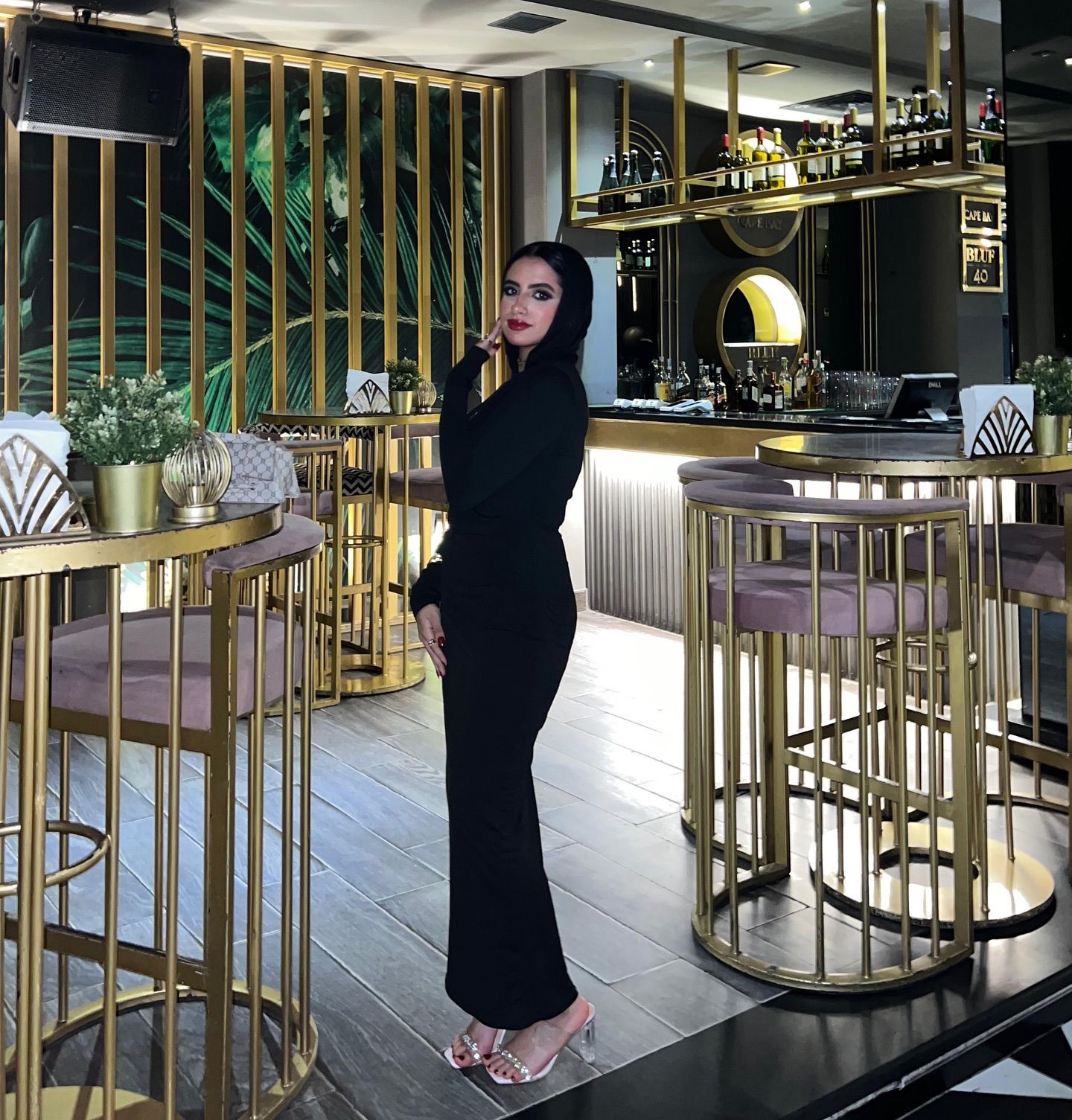 Image of Rawan Osman | روان عثمان from Instagram black dress, heels, fashion, elegant, bar setting