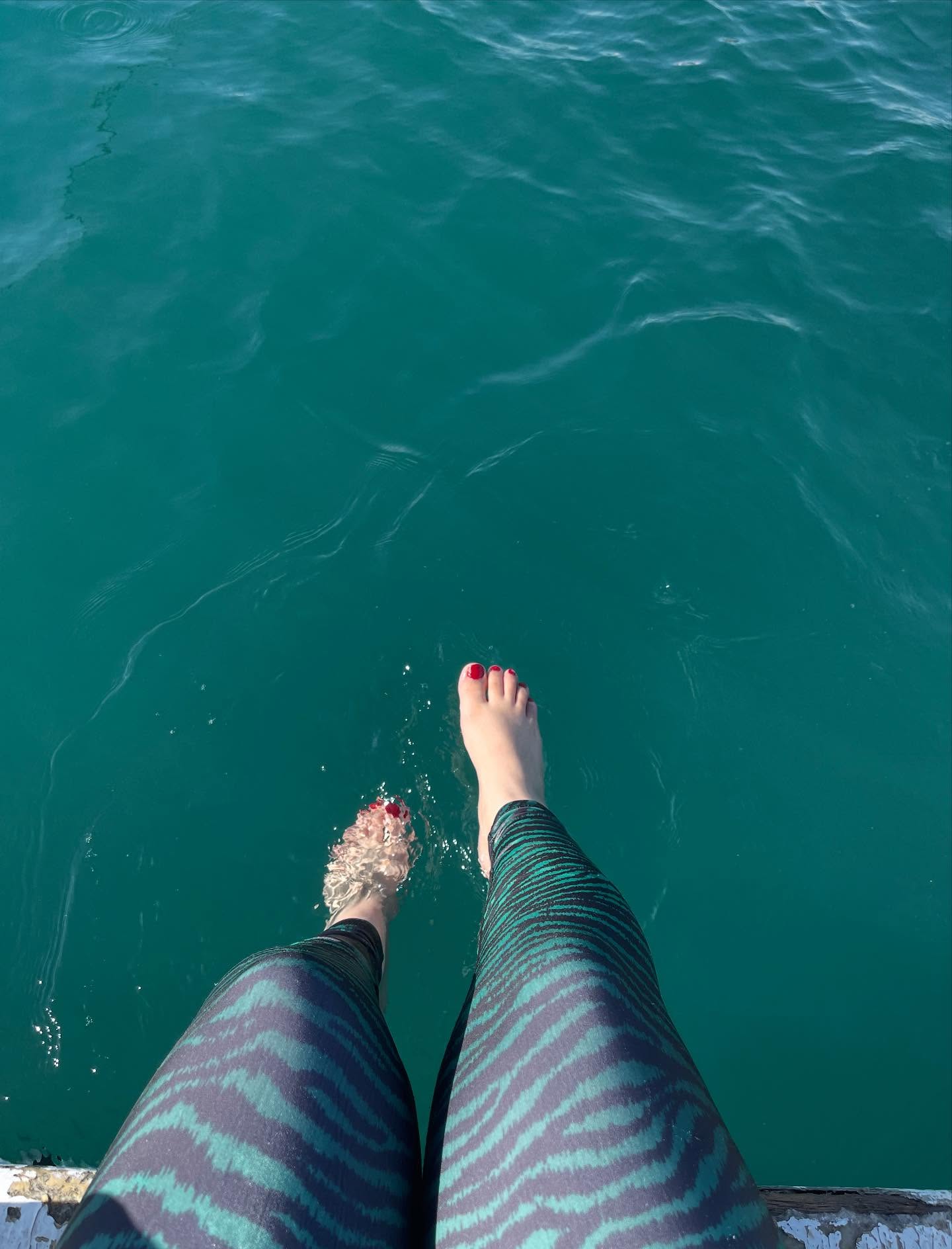 Image of Fatma E Khalifa from Instagram leggings, barefoot, water, outdoor, beach