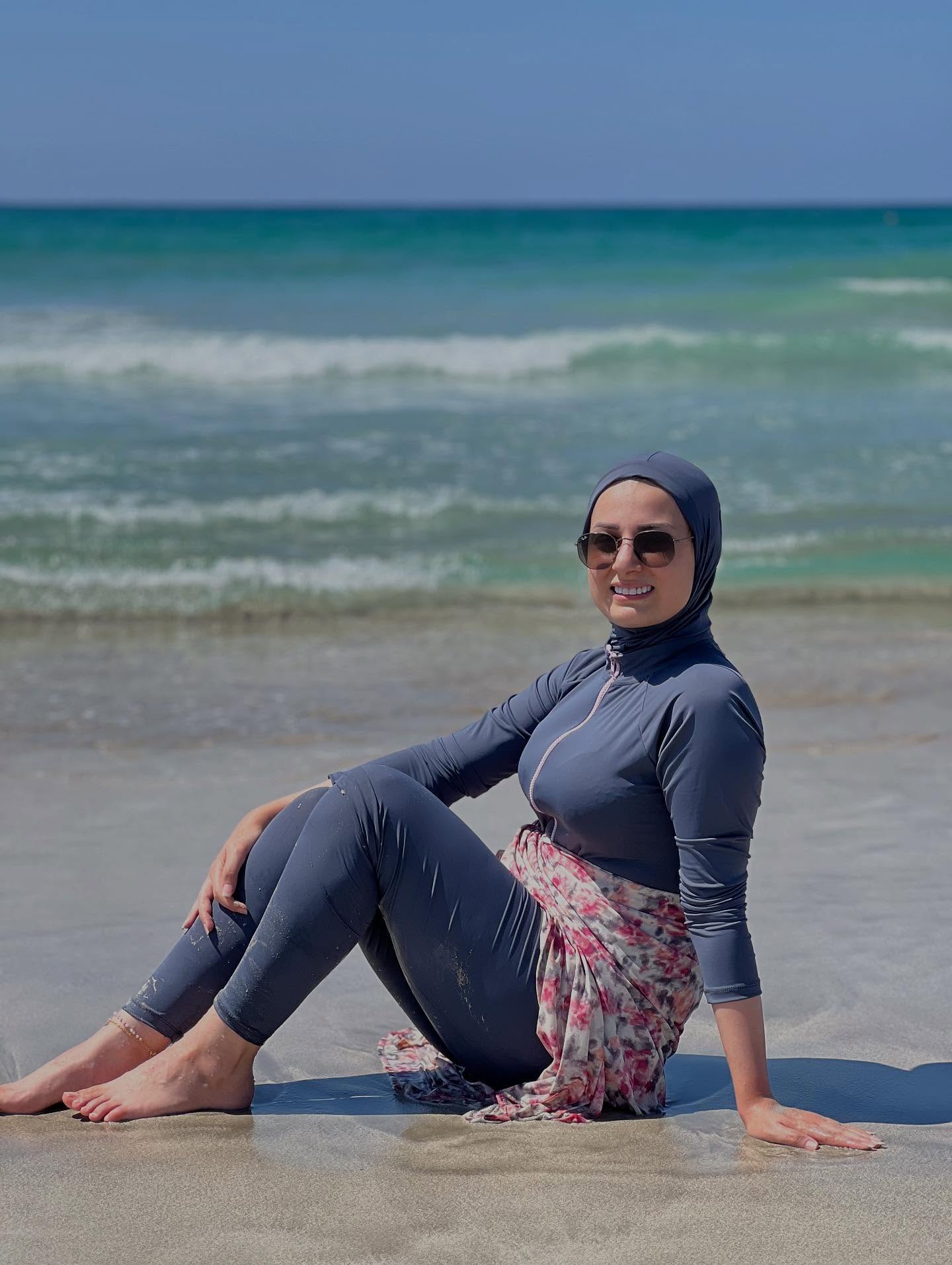 Image of ุนููุง ๐ฑ๐ง from Instagram swimwear, beach, hijab, floral, barefoot, sunglasses