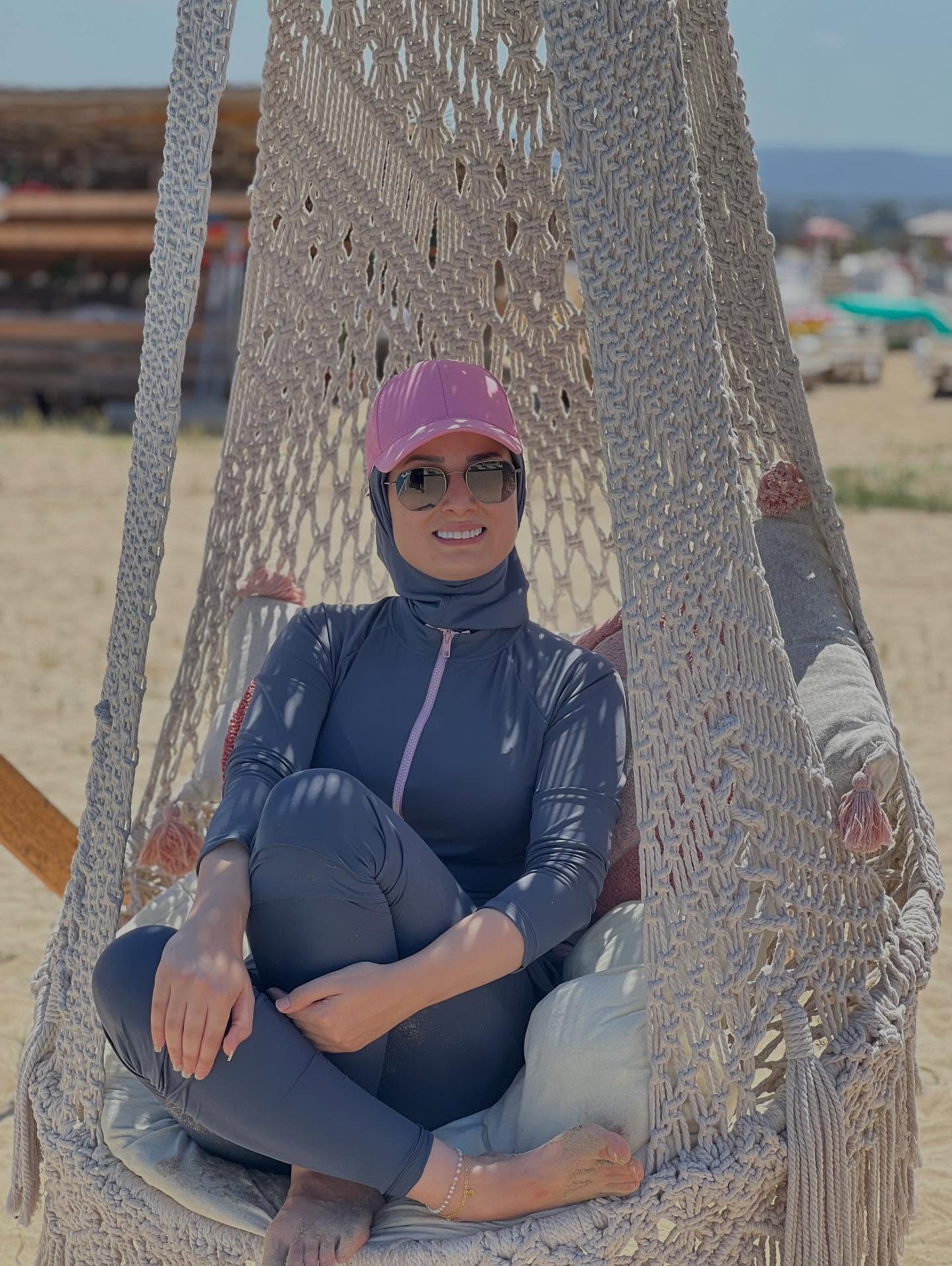 Image of عليا 🇱🇧 from Instagram beachwear, hat, sunglasses, hijab, barefoot, beach, swing