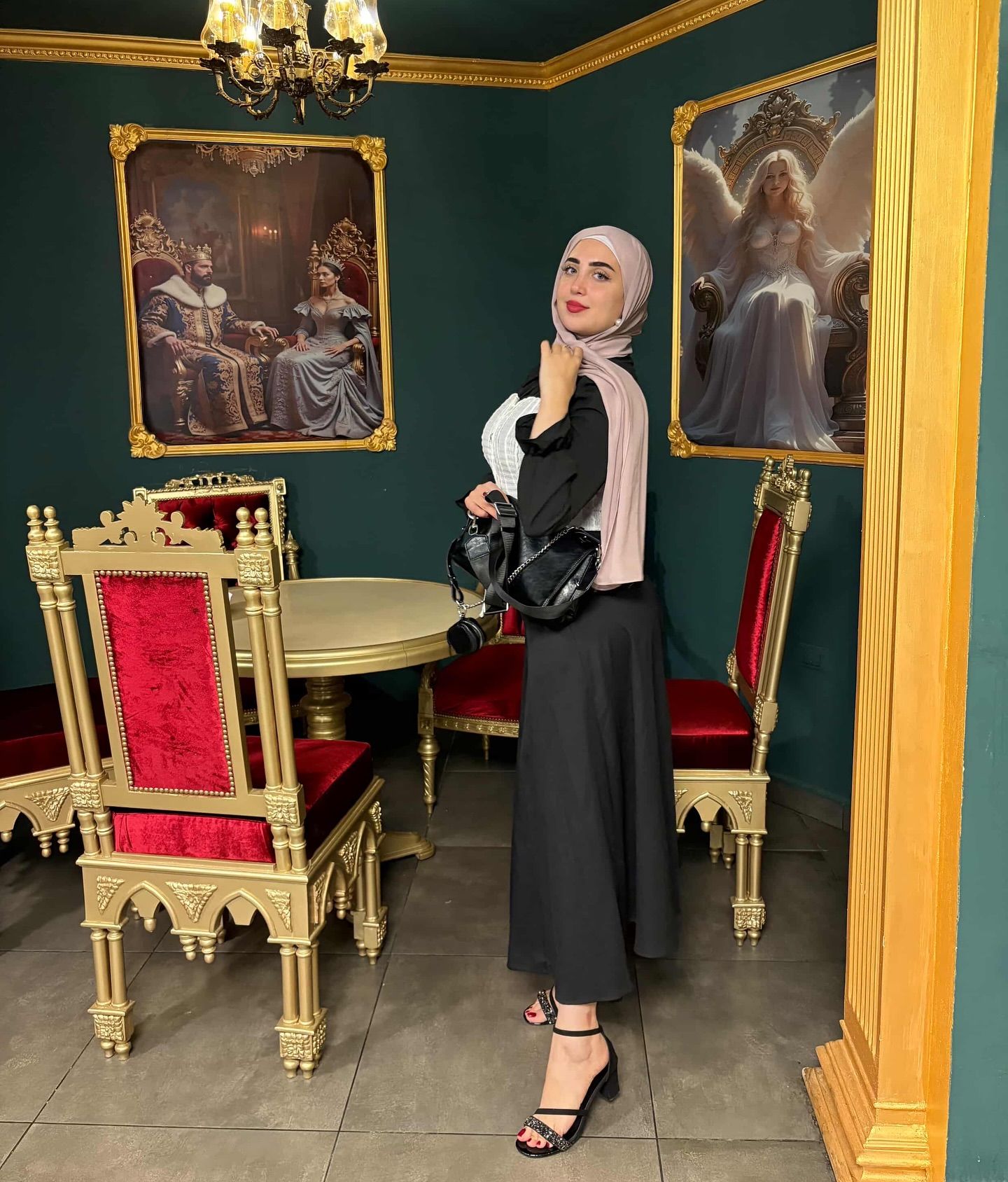 Image of World Models 🩵 from Instagram hijab, black dress, white top, black handbag, strappy sandals, indoor, ornate chairs, artwork