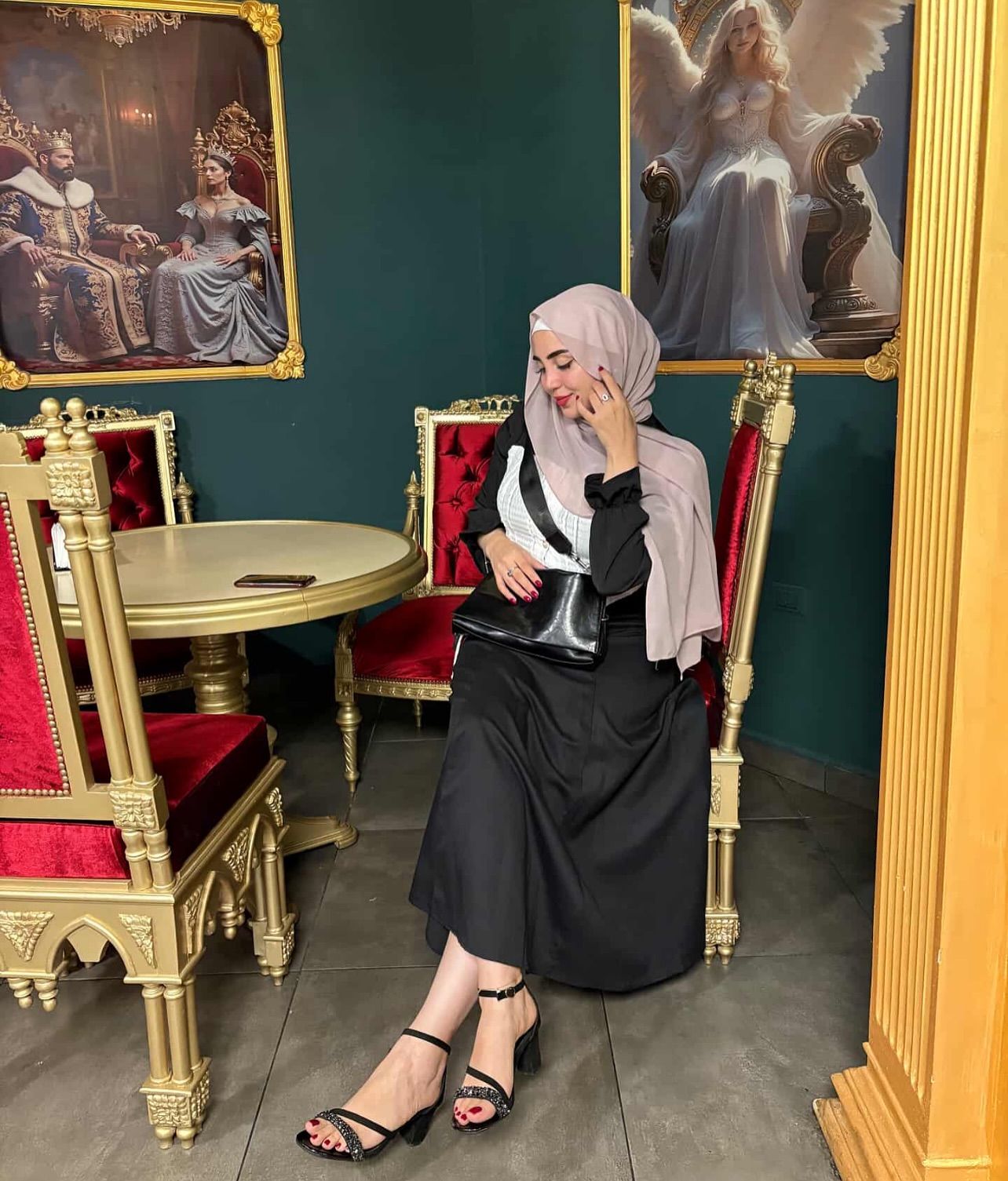 Image of World Models 🩵 from Instagram hijab, long sleeve dress, black outfit, modest fashion, strappy sandals, handbag, elegant, painting background, ornate furniture