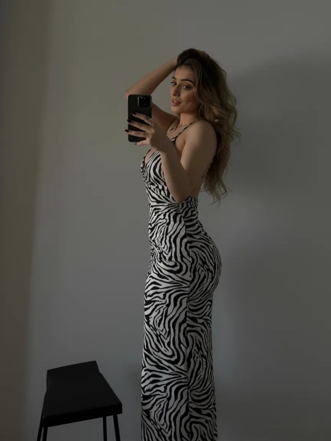 Image of Aania 👅 from Instagram zebra print dress, long dress, minimalist background, black and white