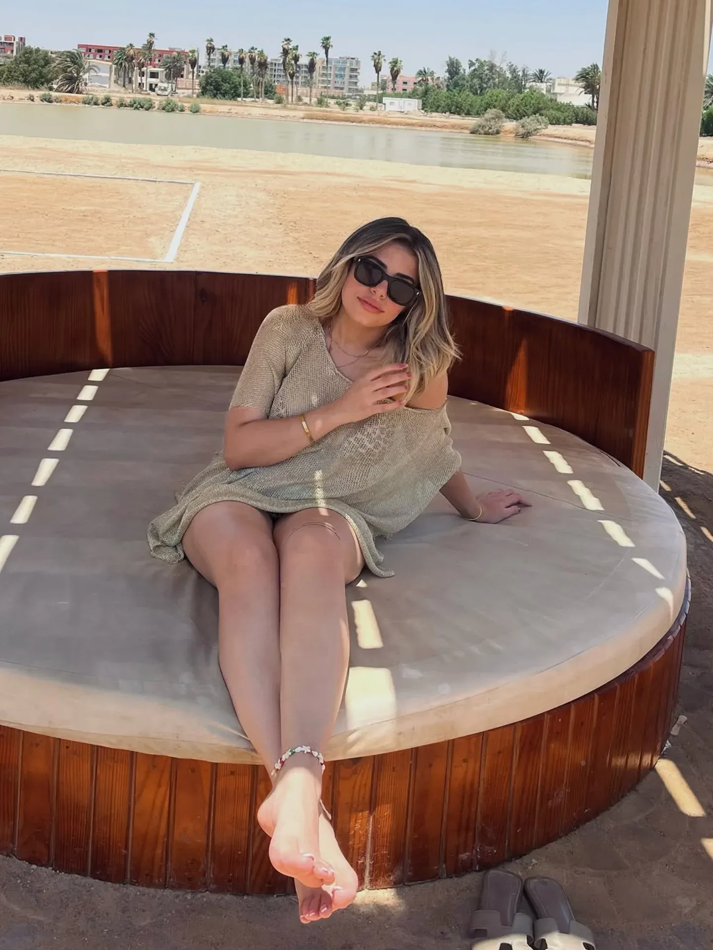 Image of arabiantread from Instagram beige dress, sunglasses, bracelet, anklet, barefoot, outdoor, seating area