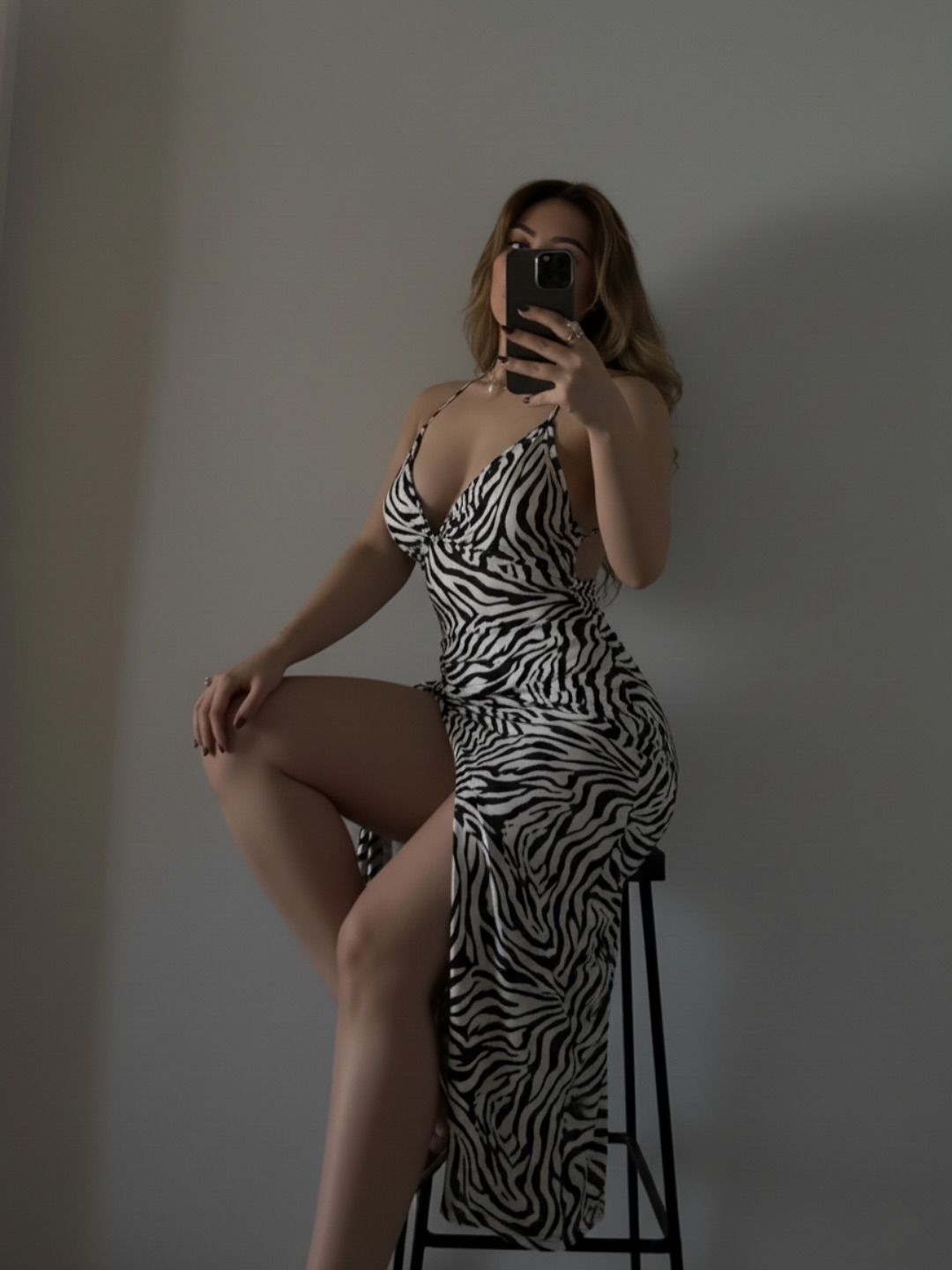 Image of Aania 👅 from Instagram zebra print, slip dress, strappy, high slit, minimalist, photography