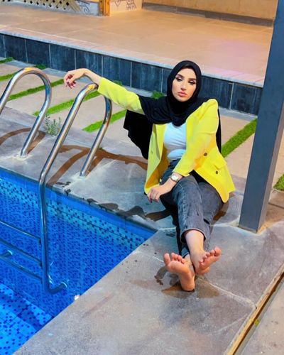 Photo by Heyam Yaseen on June 01, 2024. May be an image of 1 person, headscarf, turban, blazer and pool.