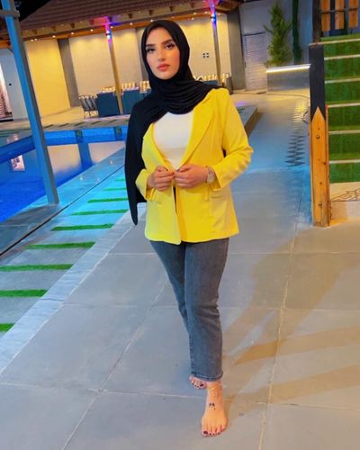 Photo by Heyam Yaseen on June 01, 2024. May be an image of 1 person, headscarf, scarf, jacket, cardigan, blazer and top.